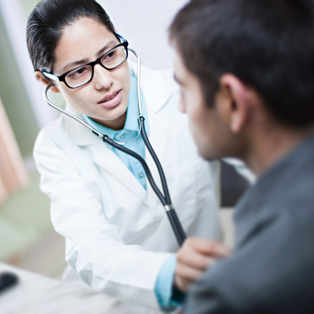 doctor checking patient with stethoscope